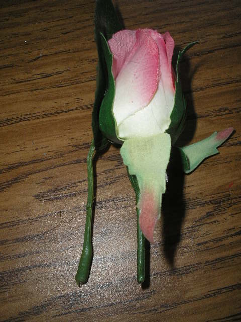 Glue (front side) of leaf to back of rose, then glue greens at base of (front) of rose