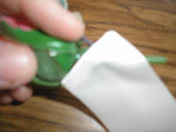 Glue one end of ribbon to the back of your rose, at a bit of a downward angle.